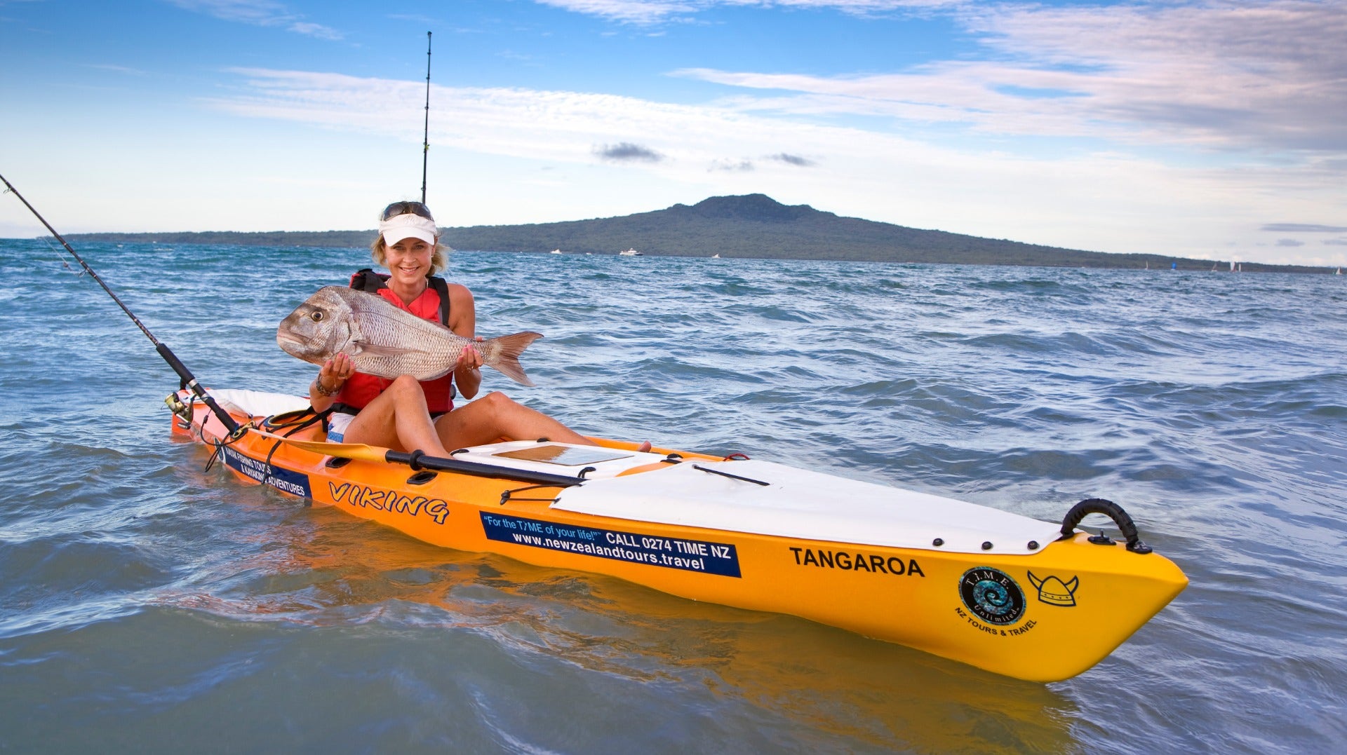 Lady on Viking Kayak holding snapper 